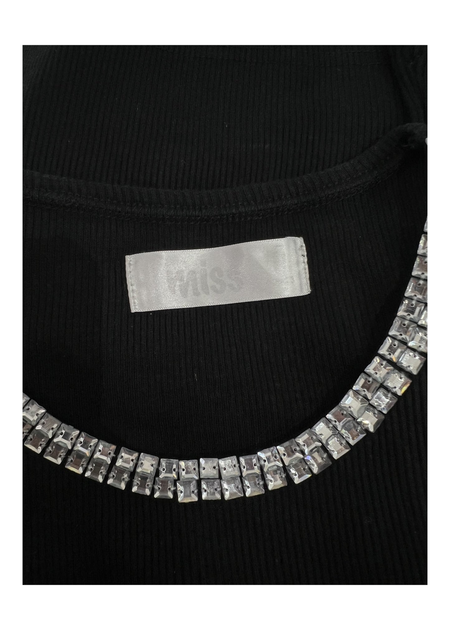 small black tank top with rhinestone neckline label