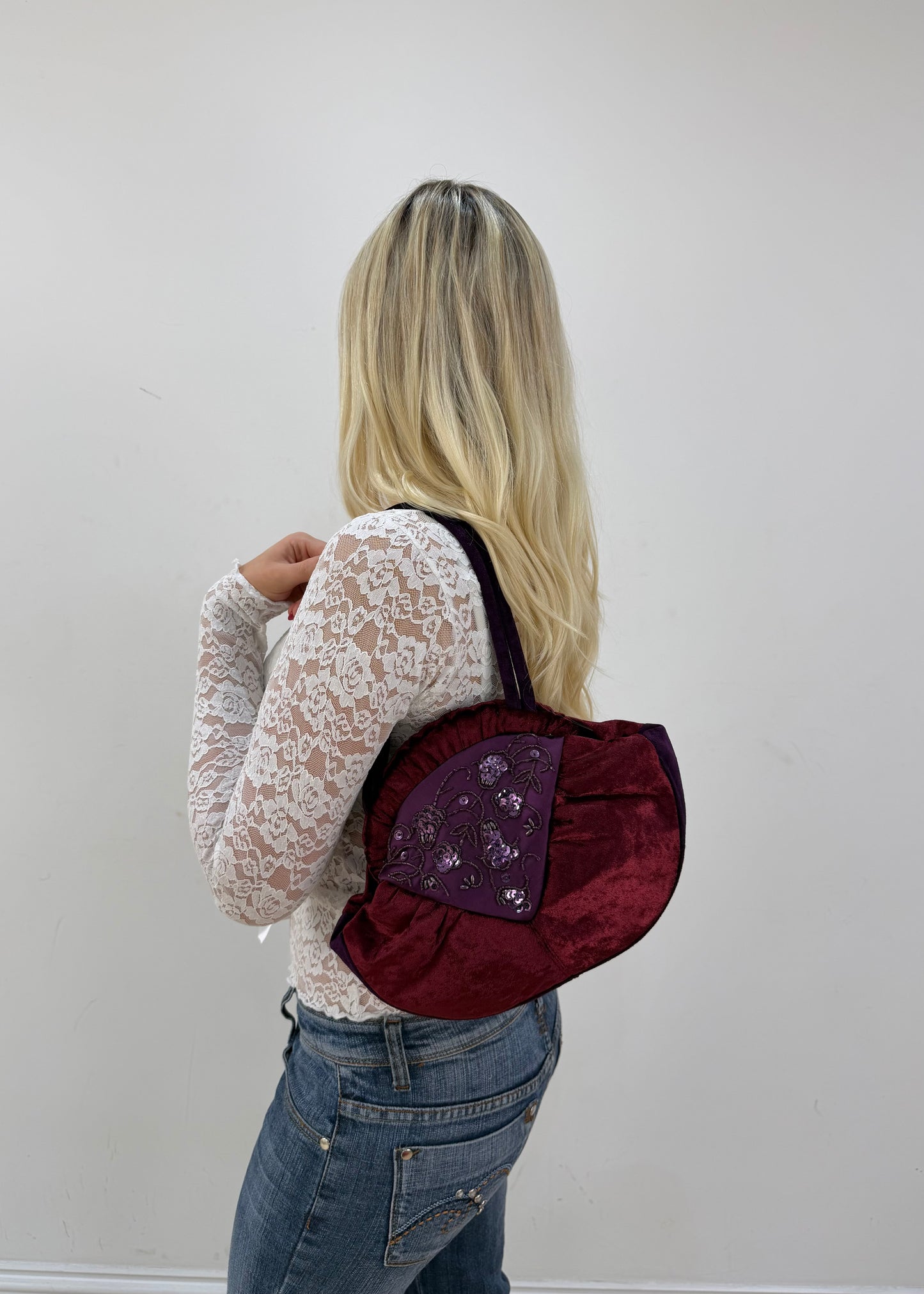 burgundy rounded handbag detail view