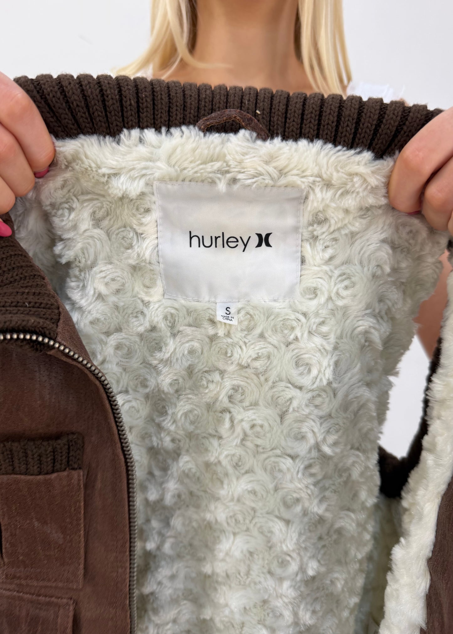 small brown hurley utility gilet label