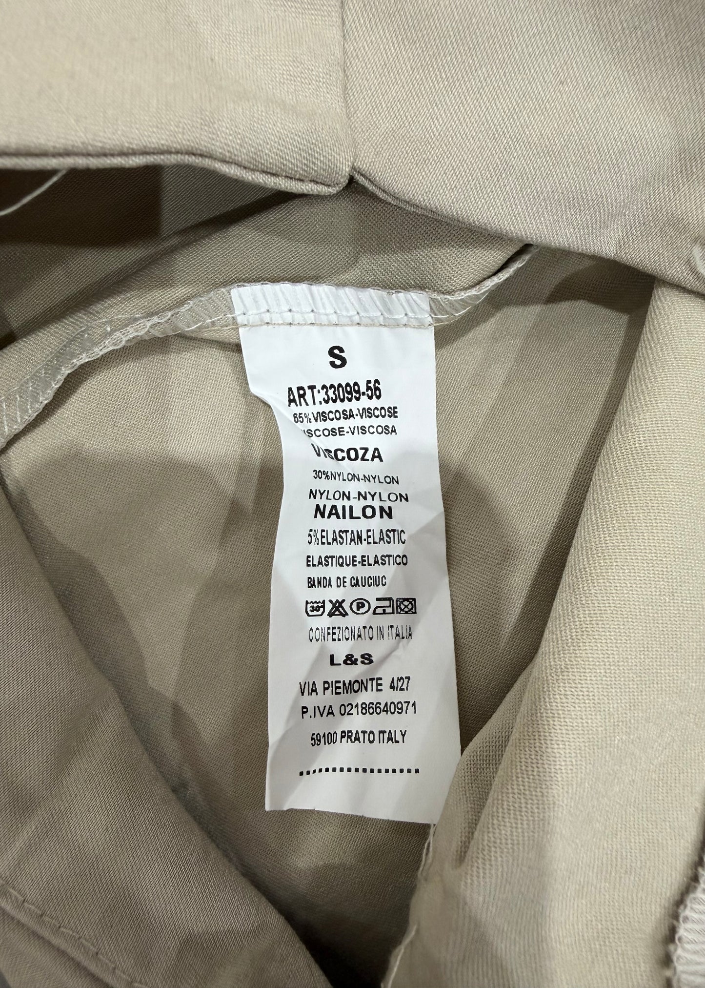 extra small beige mini skirt care label