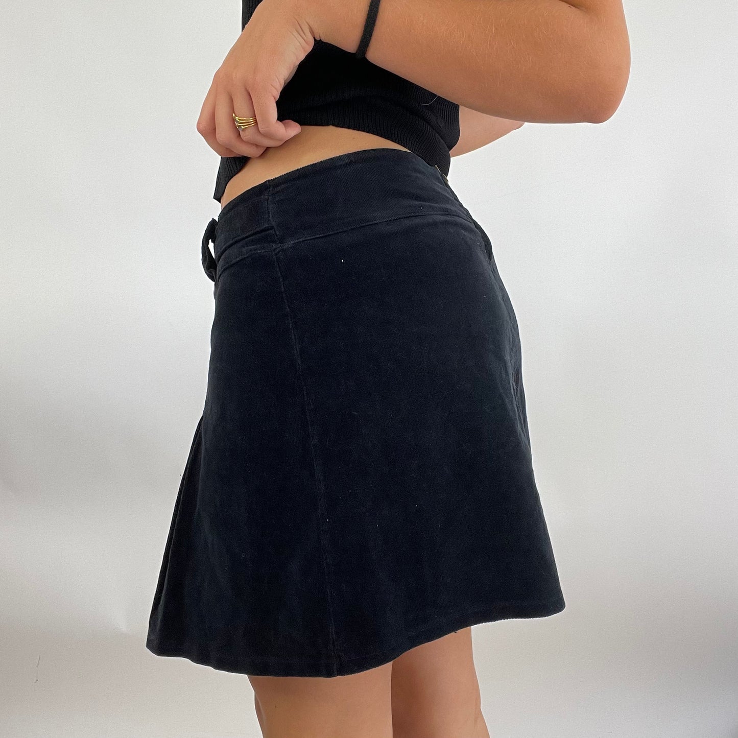 MODEL OFF DUTY DROP | small black corduroy skirt with buckle