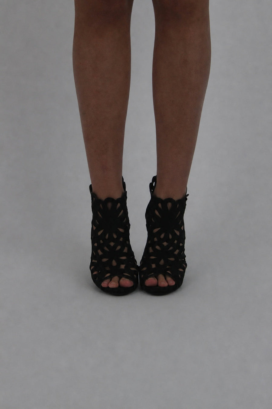 black caged peep-toe ankle boots front view