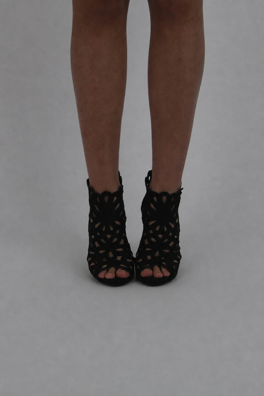 black caged peep-toe ankle boots front view