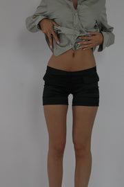 black fitted mini shorts front view