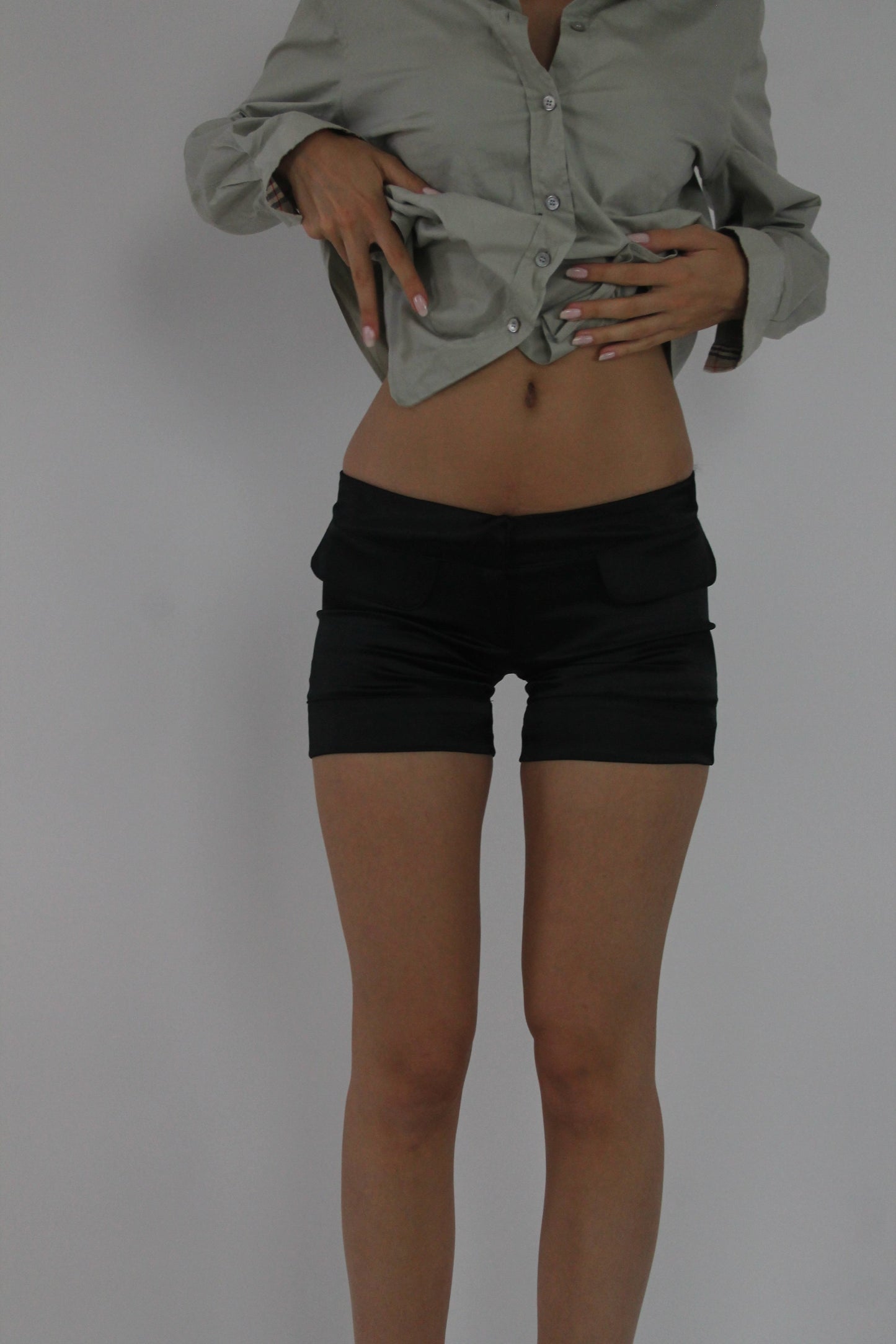 black fitted mini shorts front view