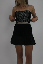 black ruffle mini skirt front view