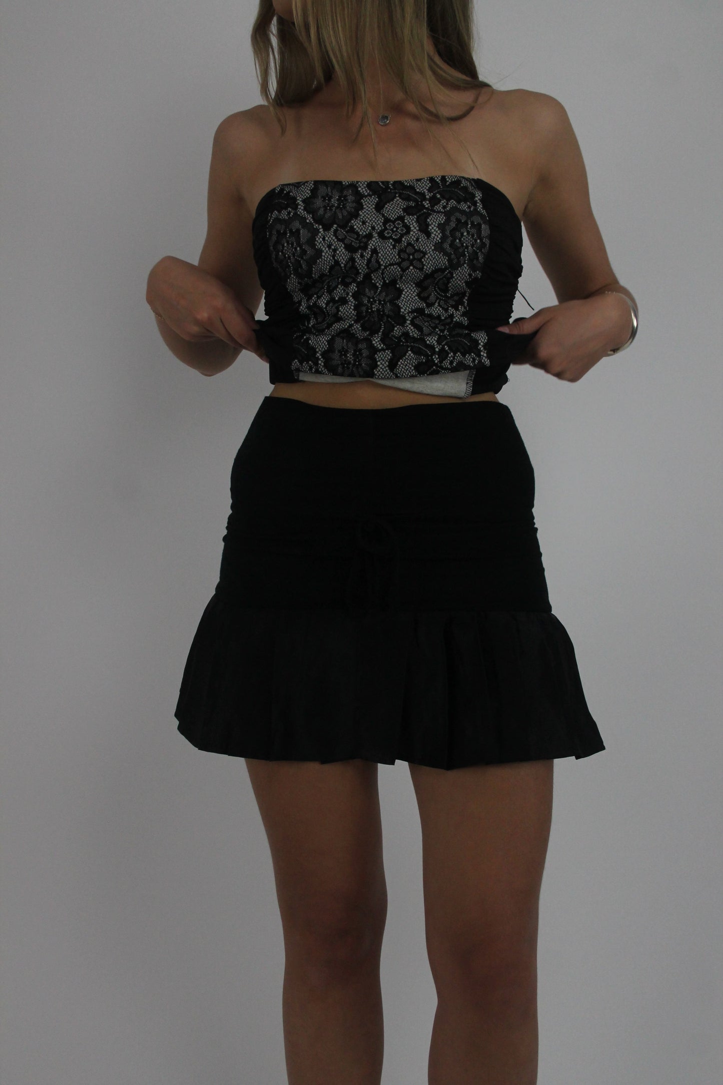 black ruffle mini skirt front view