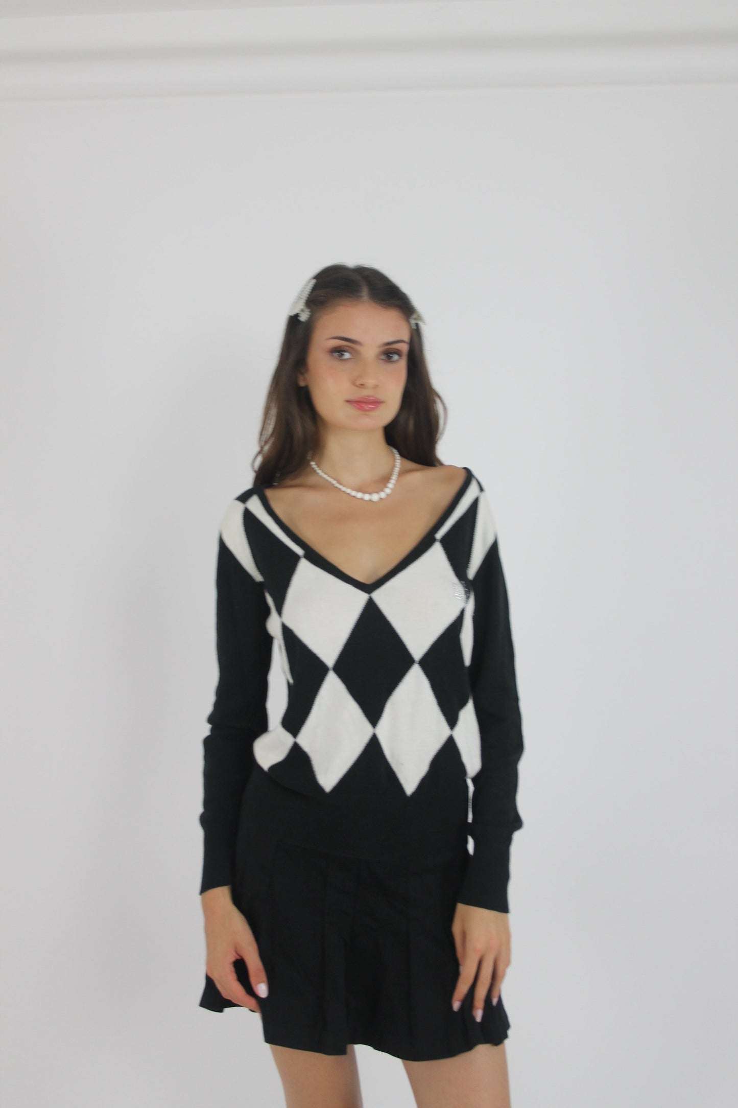 black and white argyle v-neck jumper front view