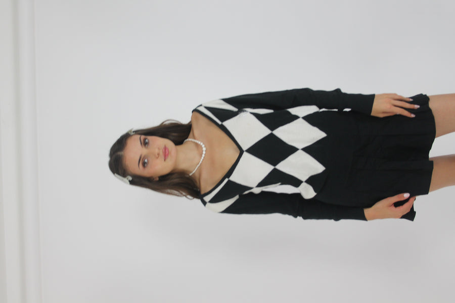 black and white argyle v-neck jumper front view