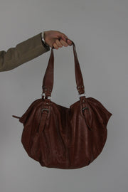 brown leather shoulder bag with buckle details front view