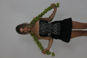 lime green pom-pom scarf front view