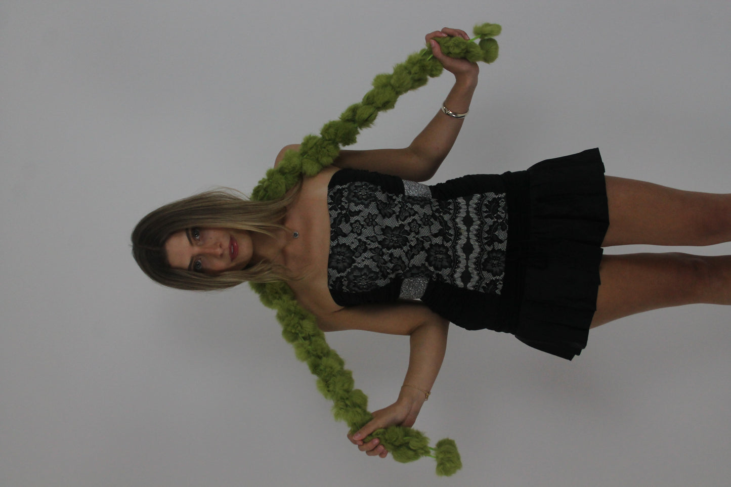 lime green pom-pom scarf front view