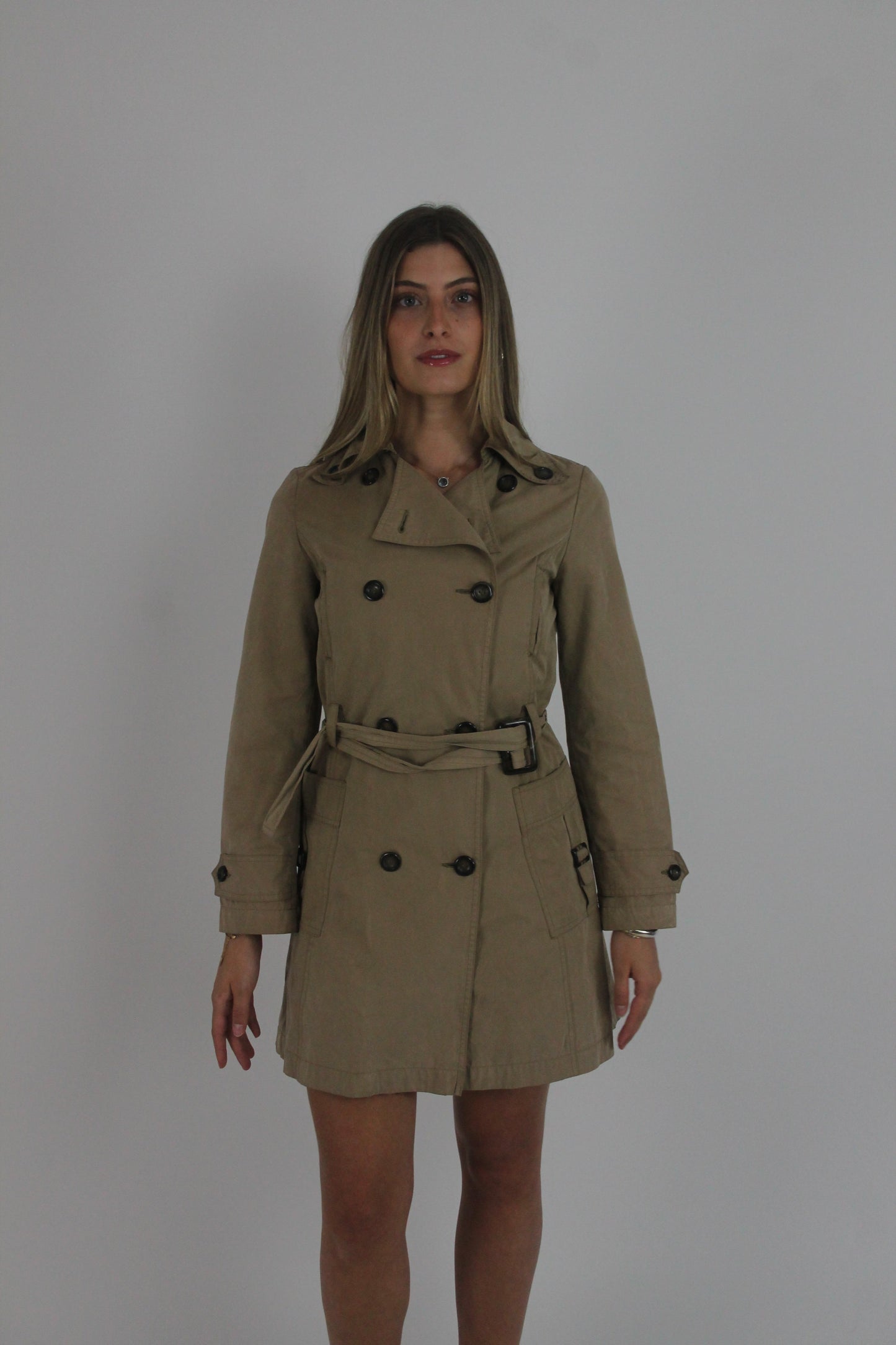 tan belted trench coat front view