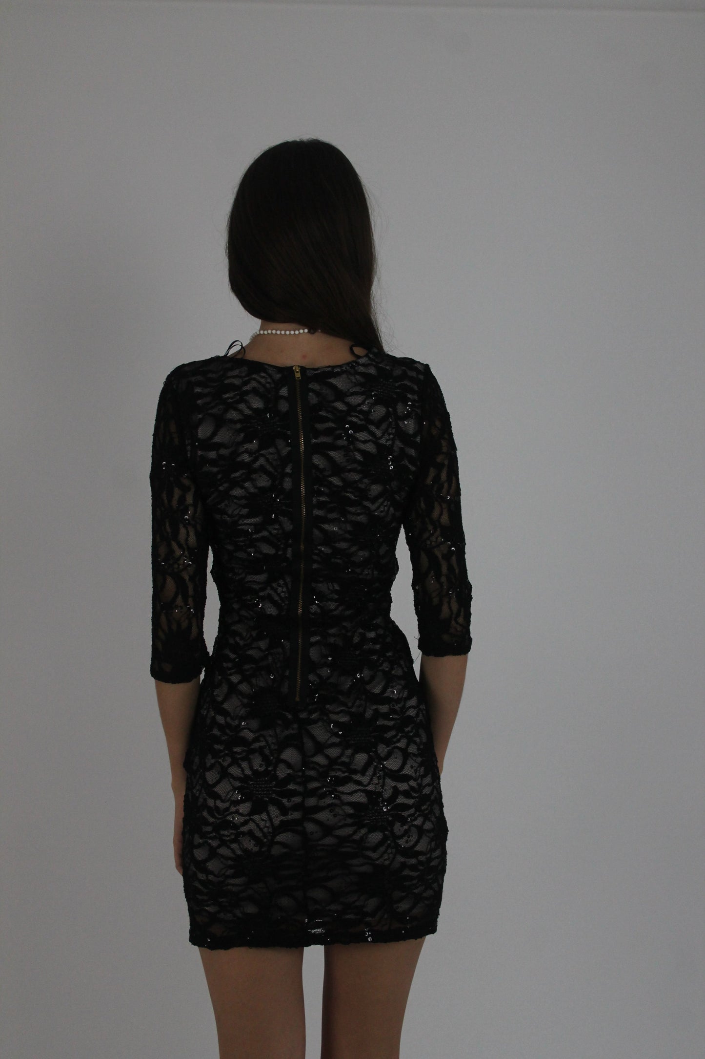 black lace three-quarter-sleeve mini dress back view