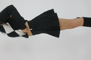 black pleated mini skirt back view