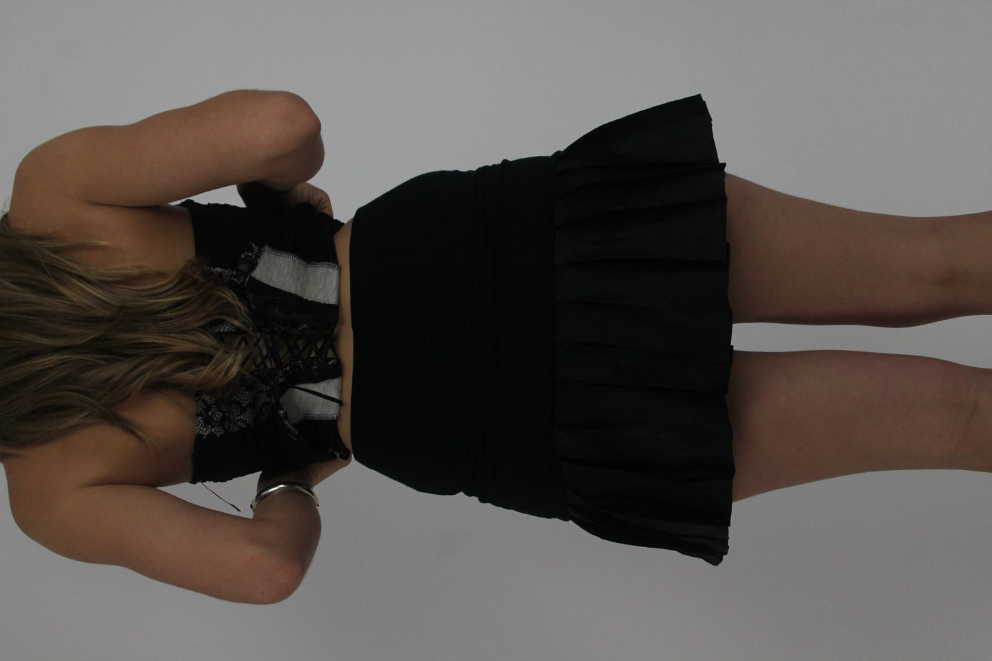 black ruffle mini skirt back view