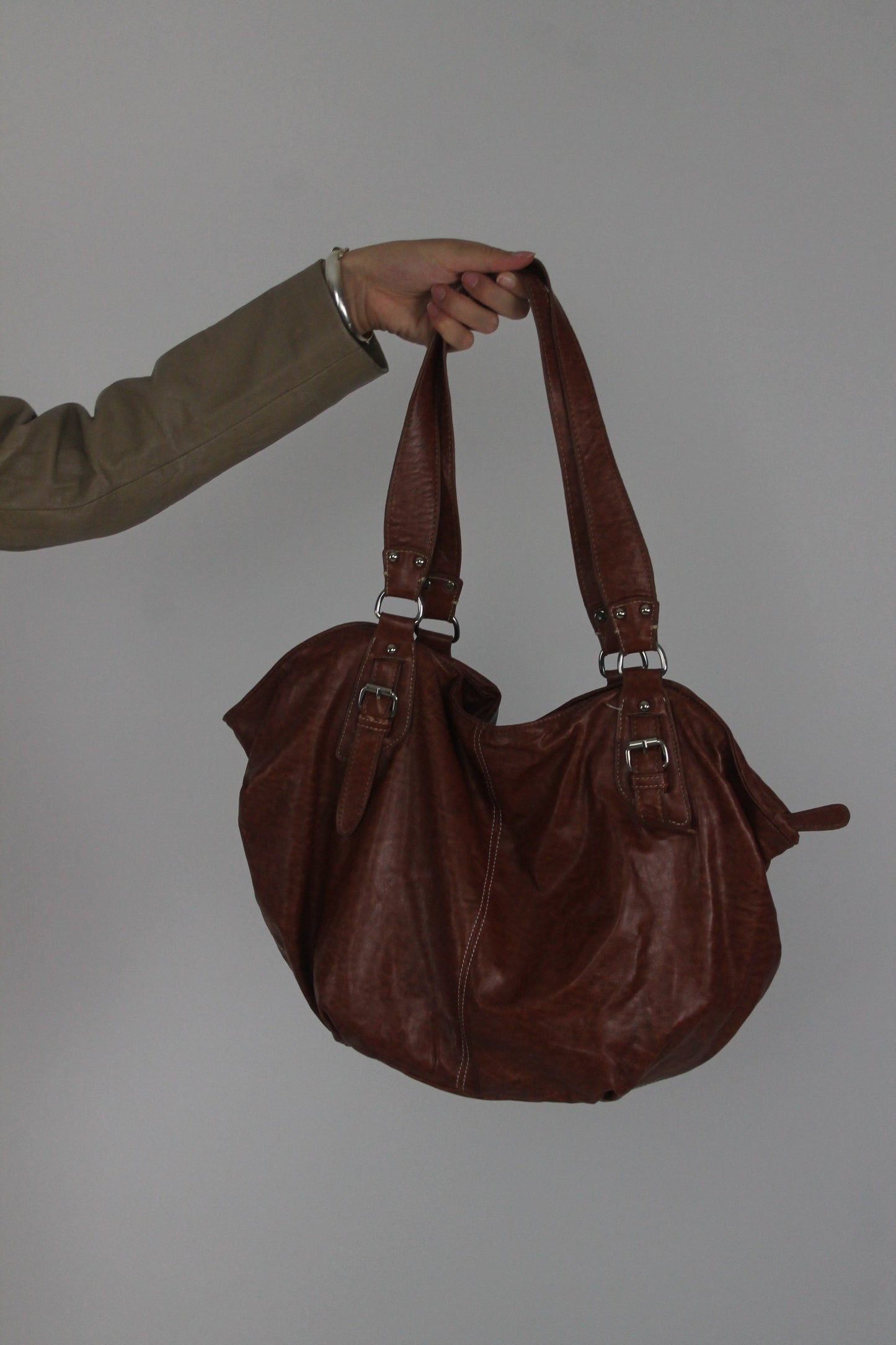 brown leather shoulder bag with buckle details back view