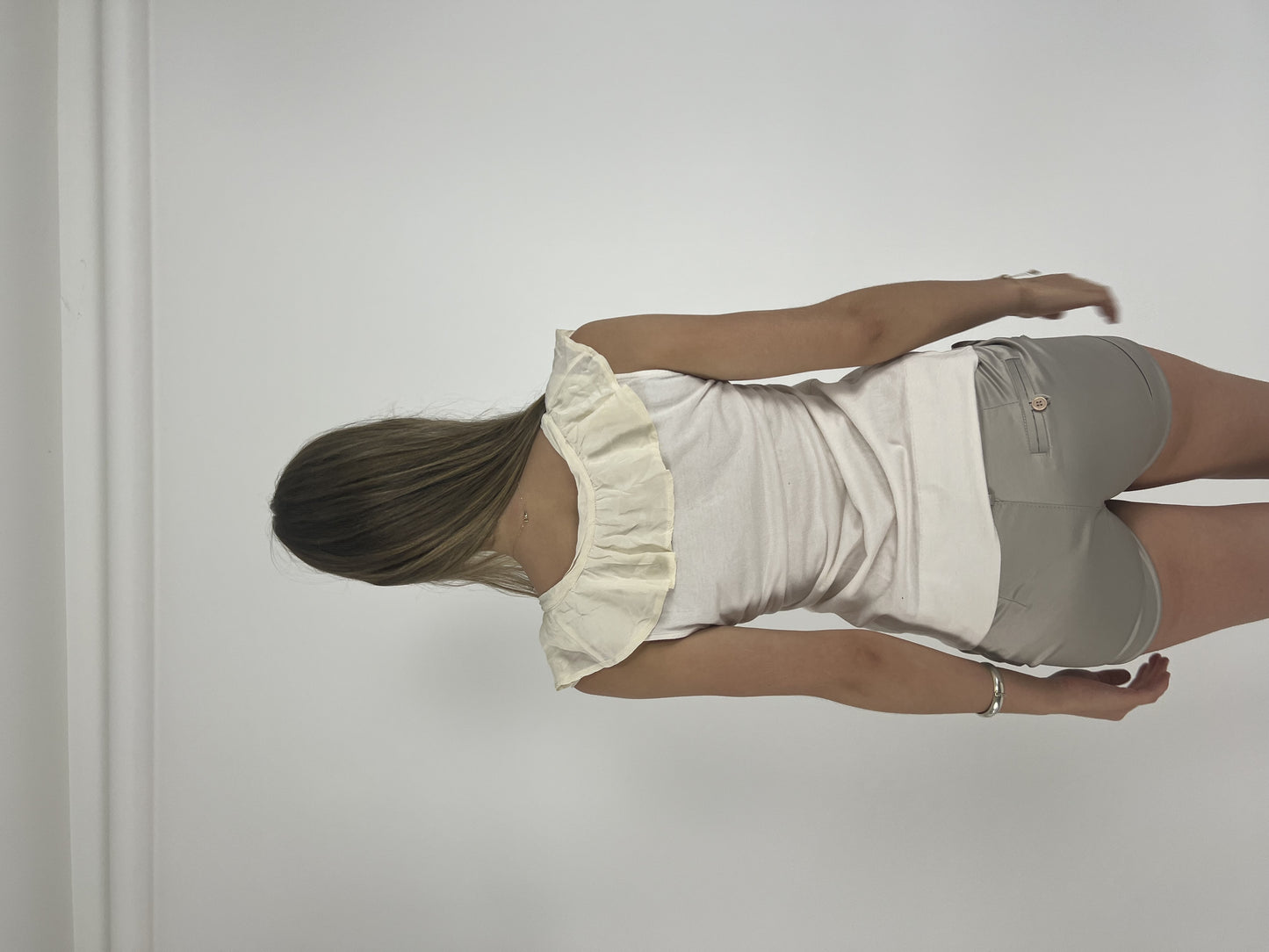 cream ruffle-neckline cap-sleeve top back view