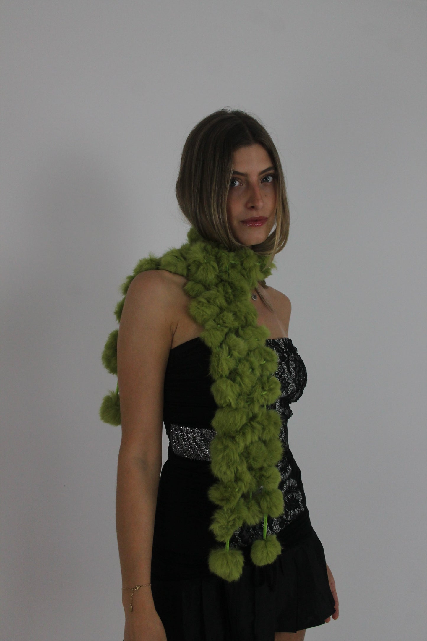 lime green pom-pom scarf back view