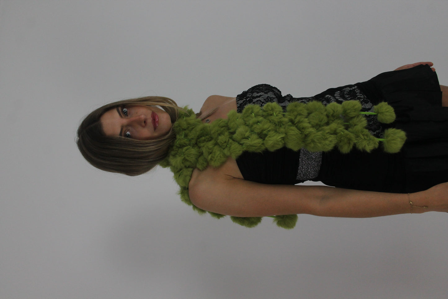 lime green pom-pom scarf back view