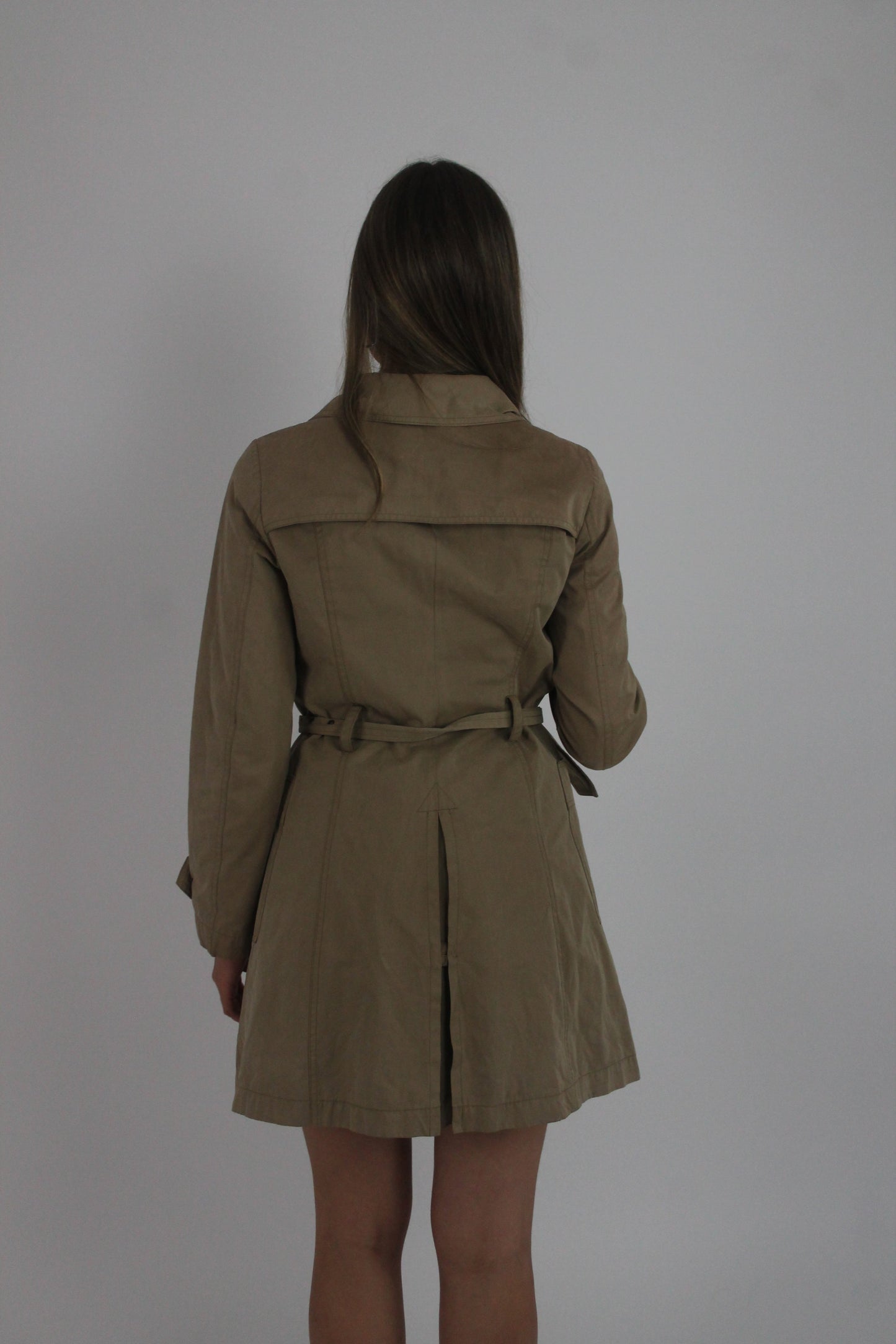 tan belted trench coat back view