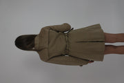 tan belted trench coat back view