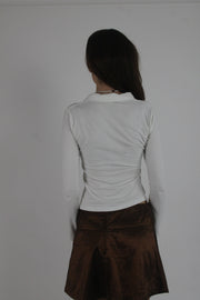 white collared v-neck long-sleeve top back view