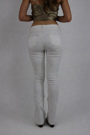 white low-rise flared jeans back view