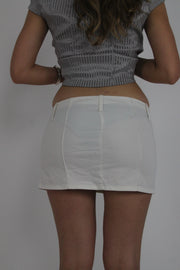 white mini skirt with front pockets back view
