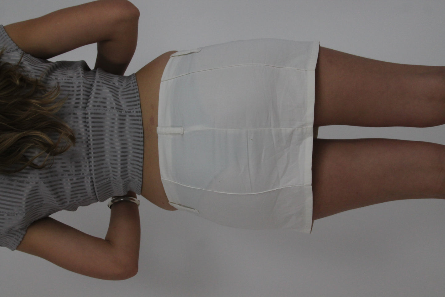 white mini skirt with front pockets back view