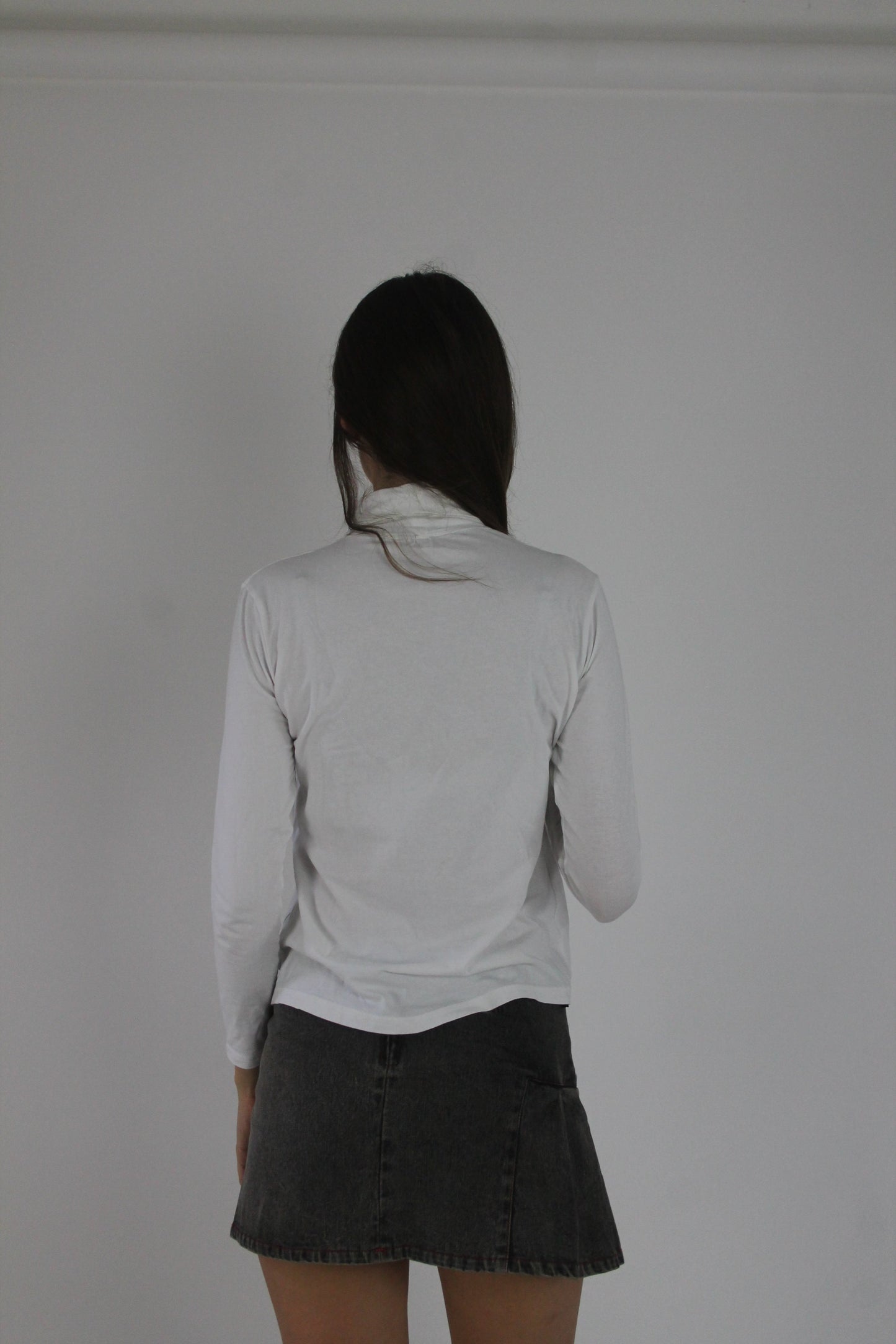 white roll-neck long-sleeve top back view
