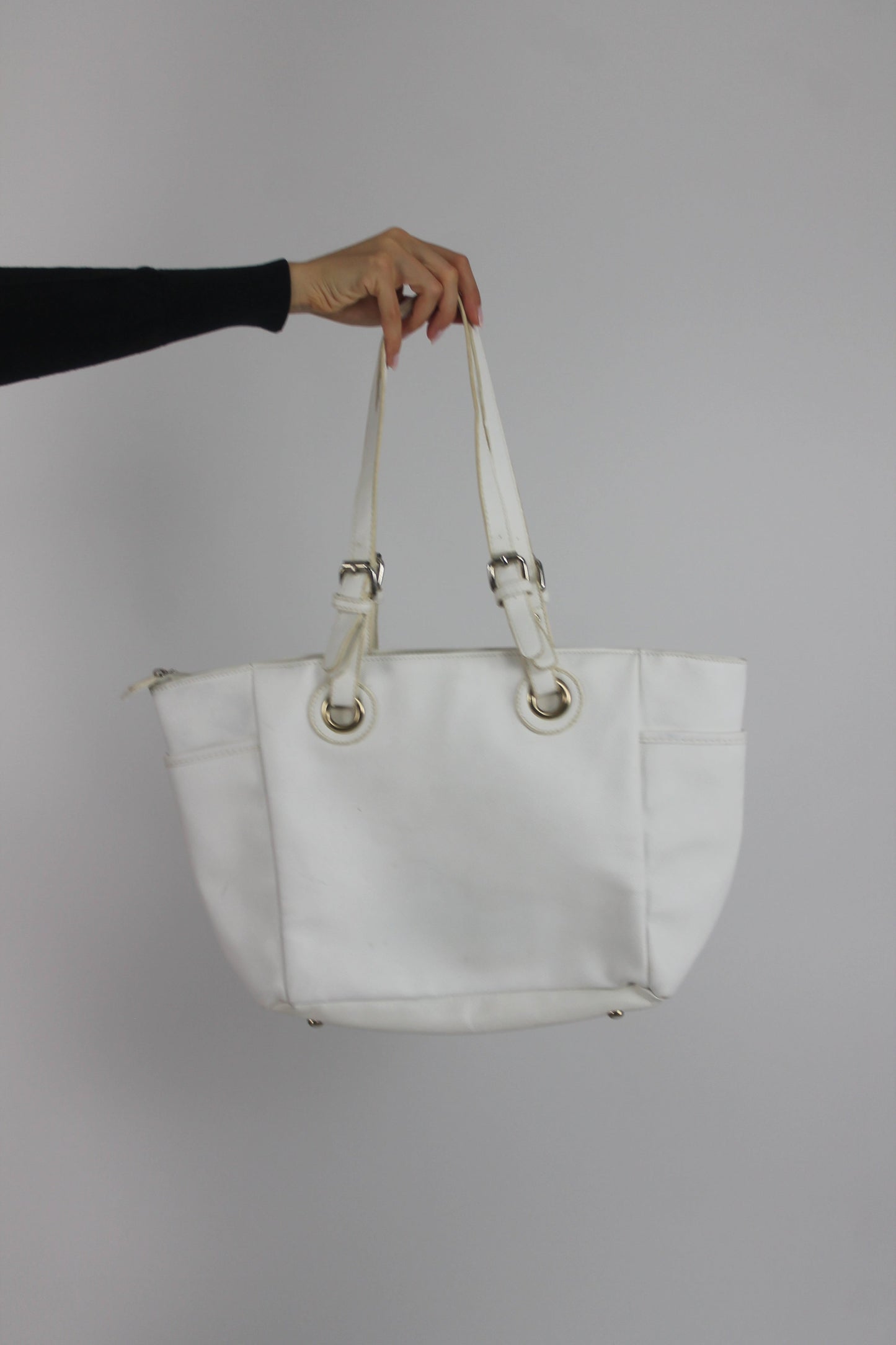 white tote bag with gold-tone hardware back view