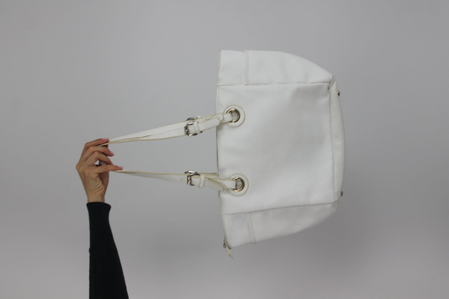 white tote bag with gold-tone hardware back view