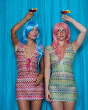 Models wearing Allegra Dresses in Candyfloss Pink and Pistachio Green