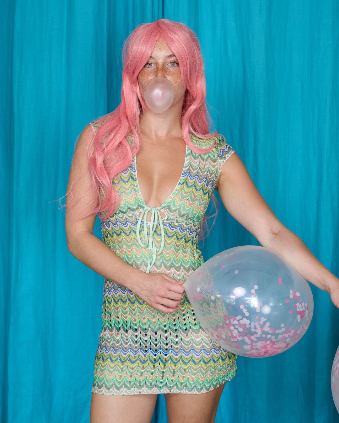 Allegra Dress in Pistachio Green – campaign portrait with pink wig