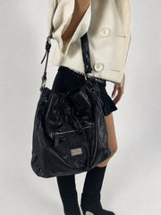 black hobo handbag with hanging details detail 01