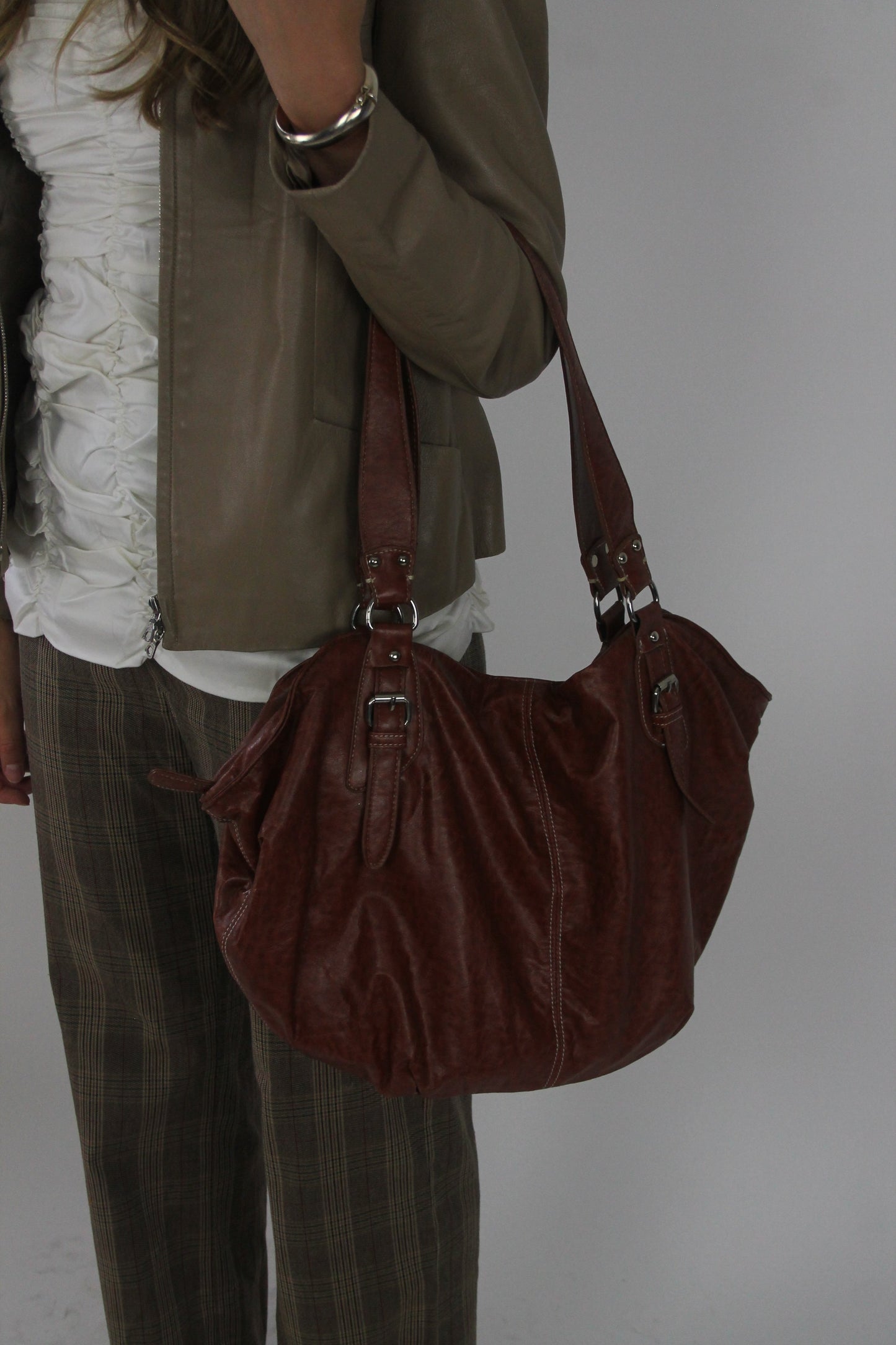 brown leather shoulder bag with buckle details detail view 01