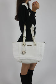 white tote bag with gold-tone hardware detail view 01