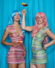 Models wearing Allegra Dresses in Candyfloss Pink and Pistachio Green