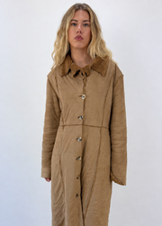 medium brown afghan long coat - zoomed close-up buttoned with model face