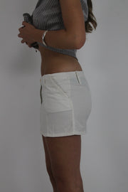 white mini skirt with front pockets detail view 02