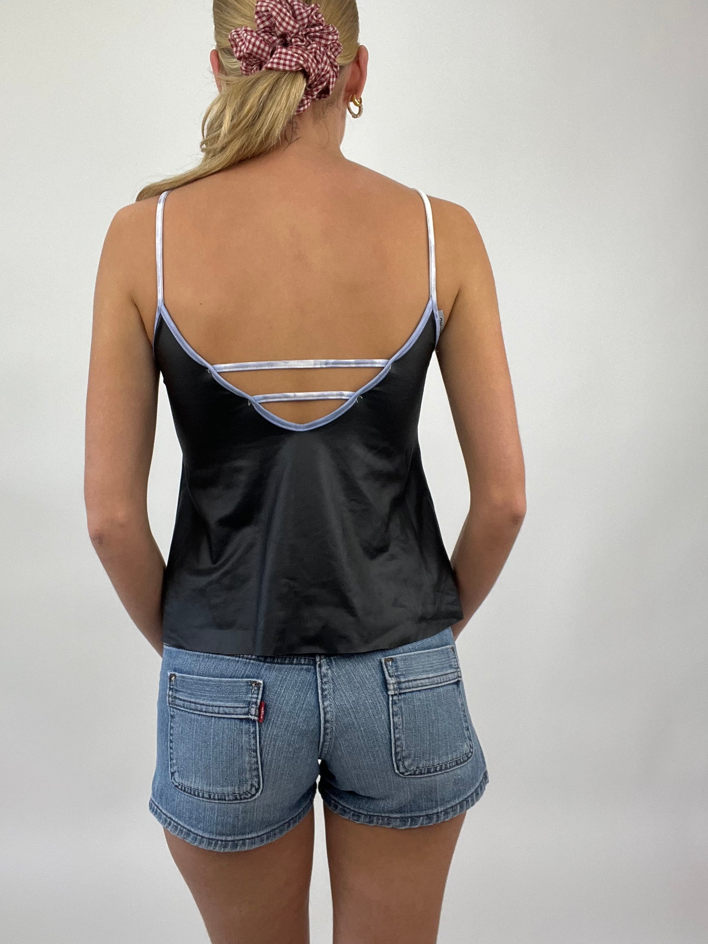 COASTAL COWGIRL DROP | small black cami with purple ‘no1 cares’ at all spell out