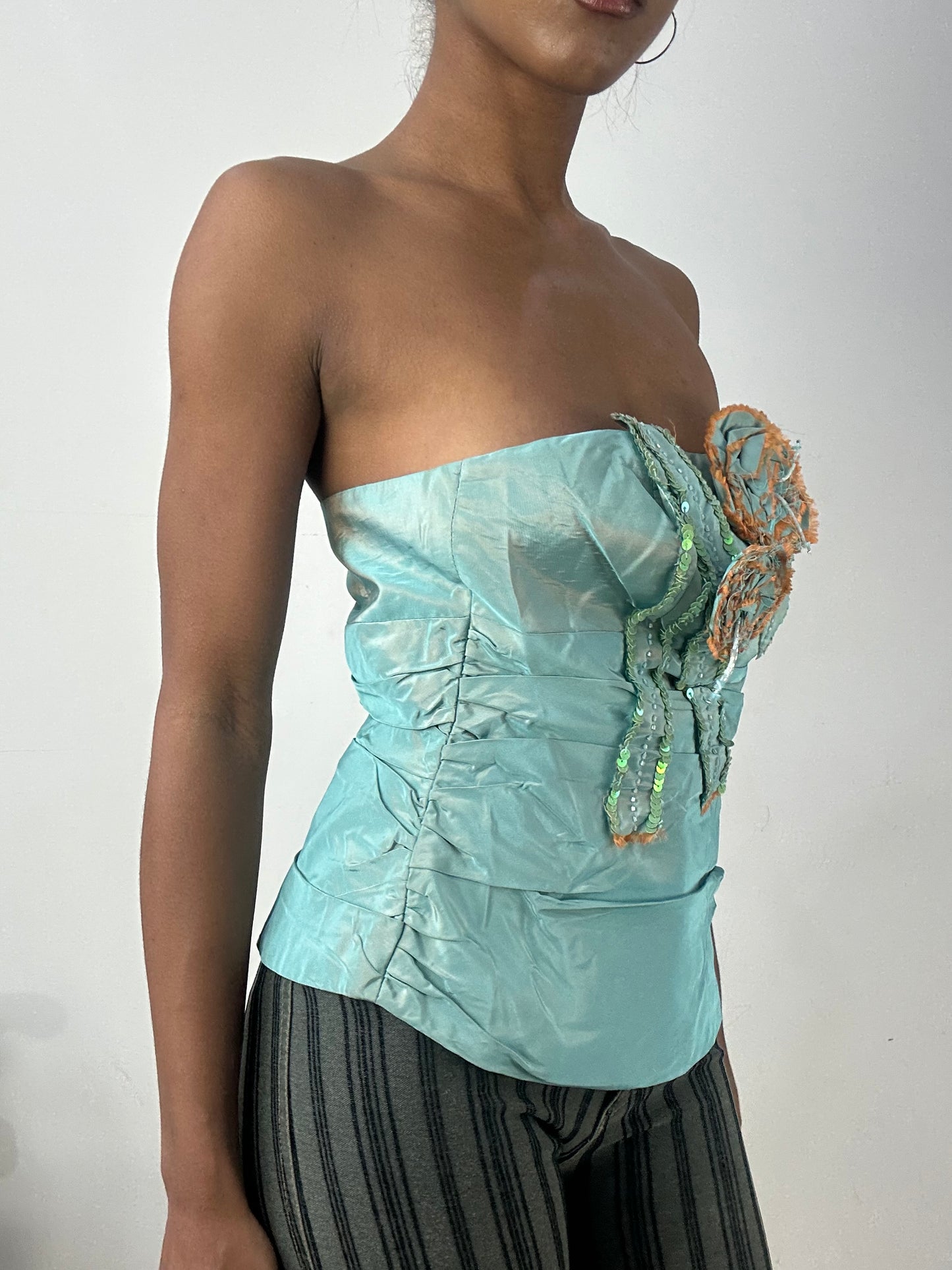 BEST PICKS | small blue iridescent corset top with 3d flower detail