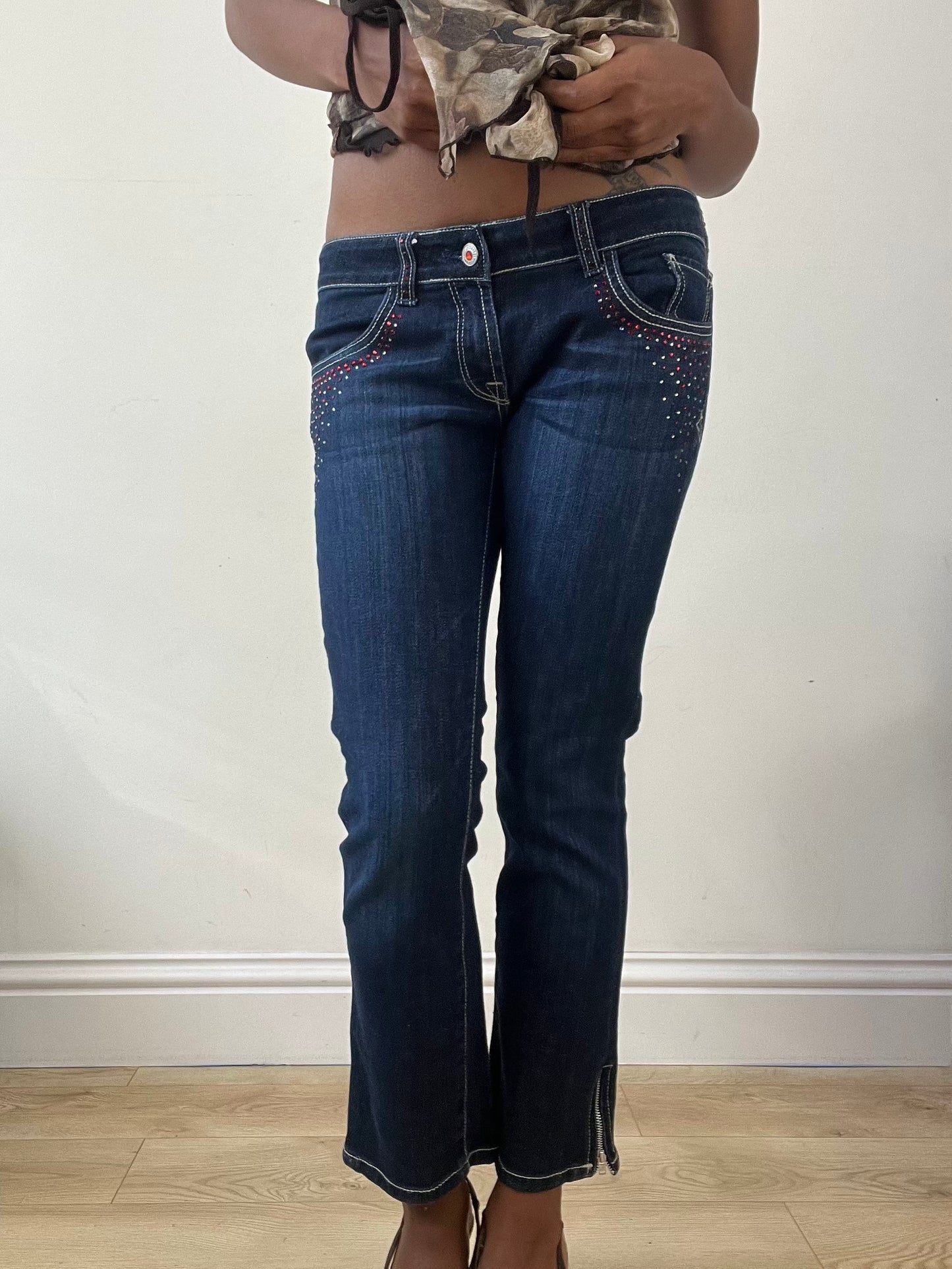 BEST PICKS | small blue denim bootcut jeans with rhinestone details