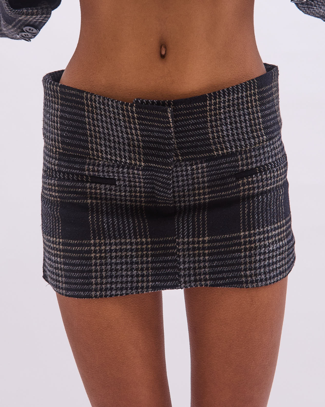 the alma skort in black tartan