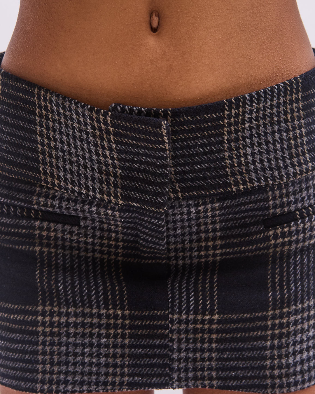 the alma skort in black tartan