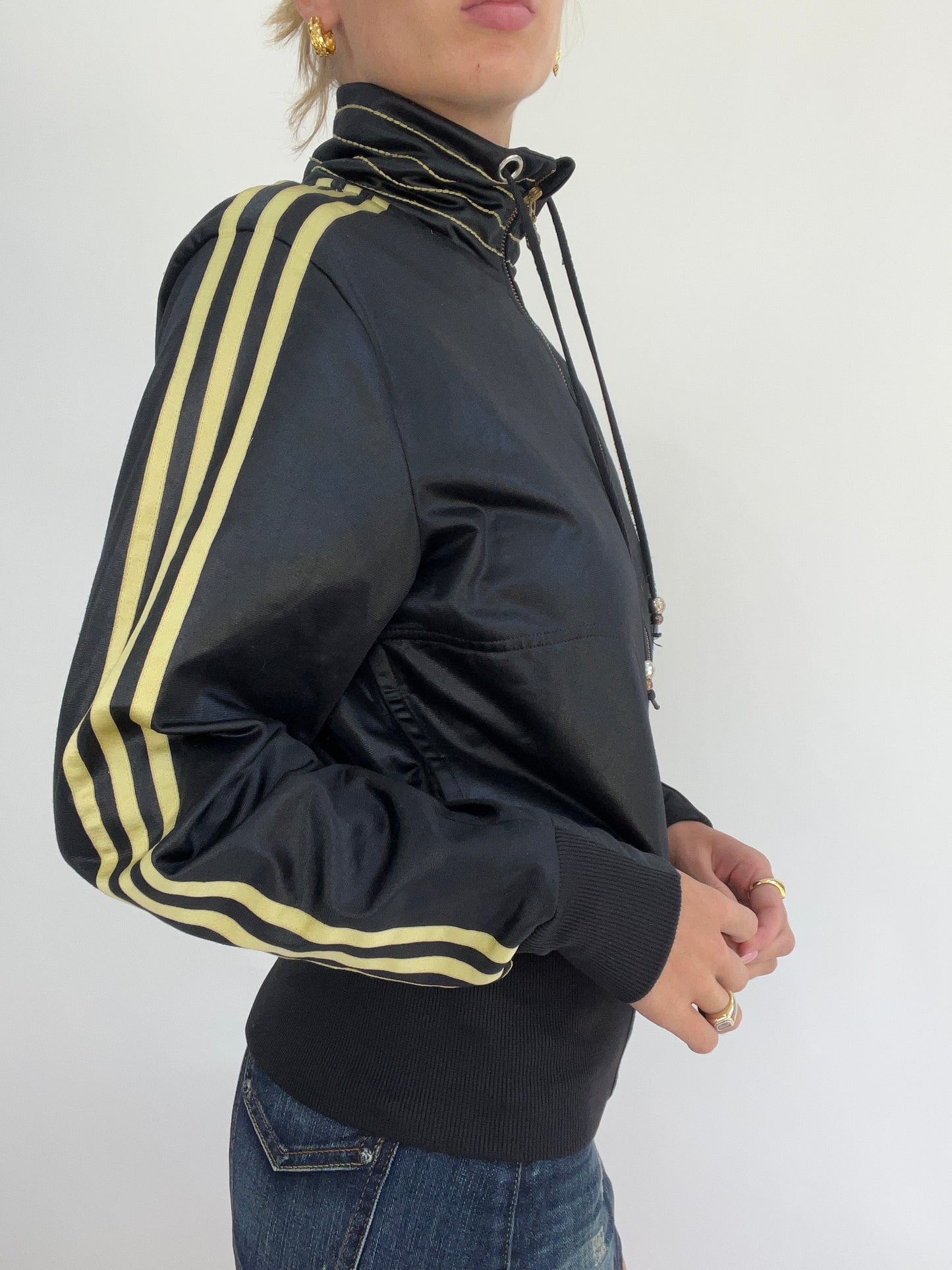 MADELINE ARGY DROP | medium black adidas zip up jacket with gold stripes