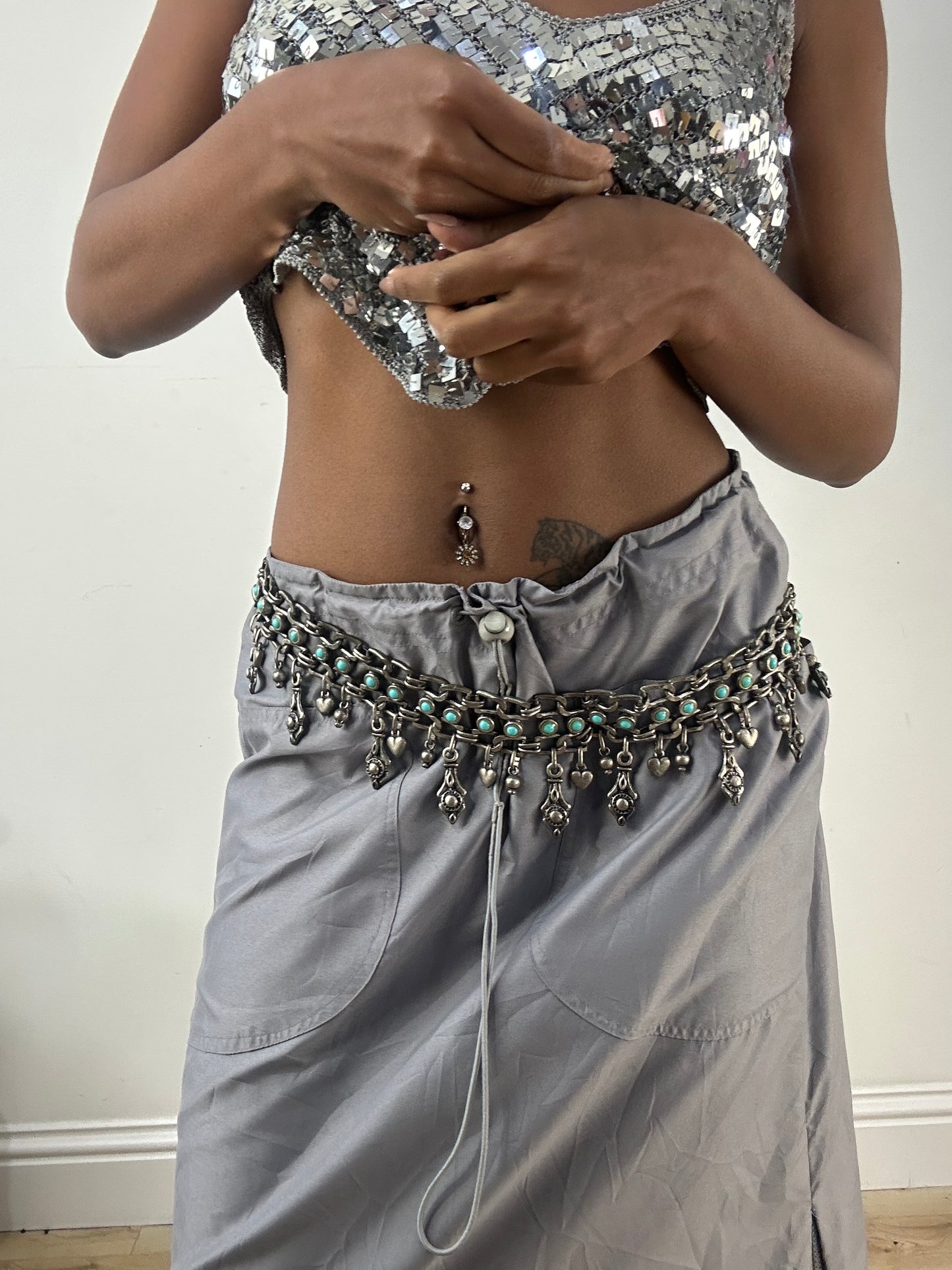 BEST PICKS | silver and blue chain belt with drop metal hardware details
