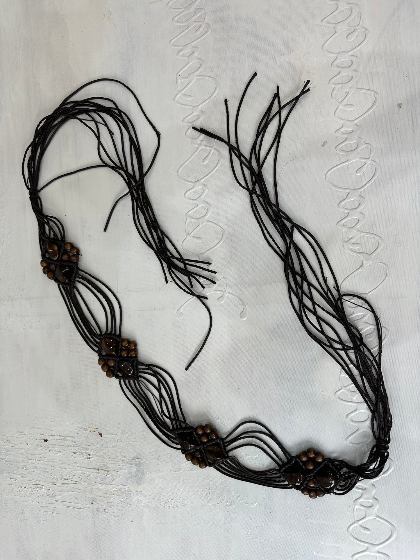 BEST PICKS | brown braided tassel belt with brown beading details