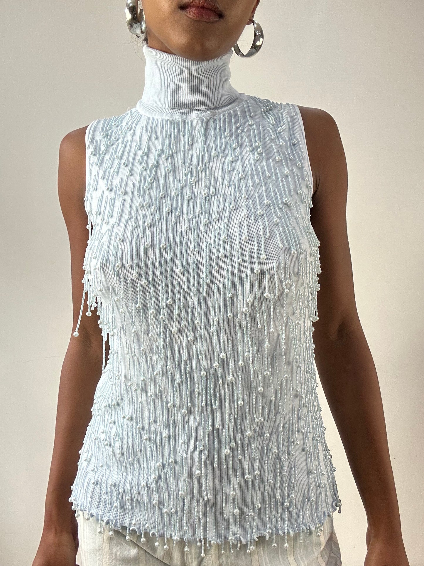 LFW edit | small baby blue sleeveless turtleneck top with beading detail
